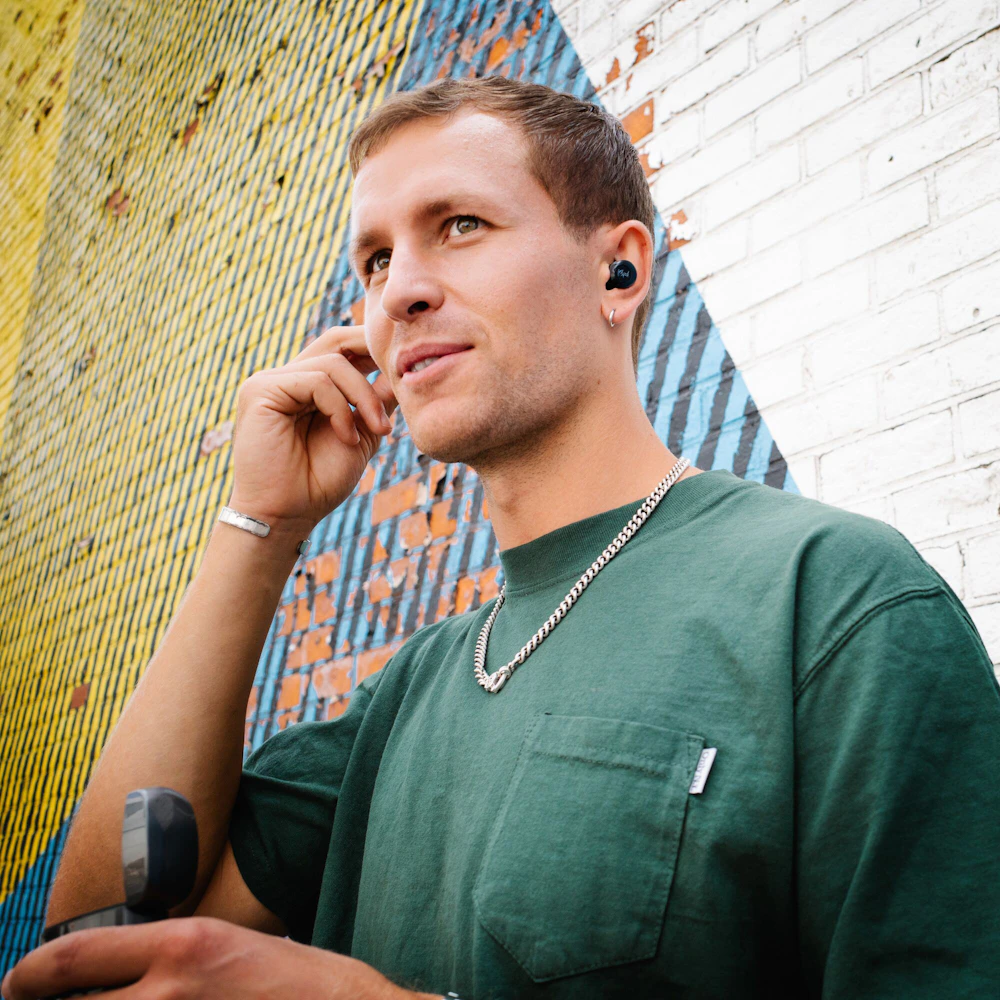Klipsch T5 II active noise canceling earbuds man with earring