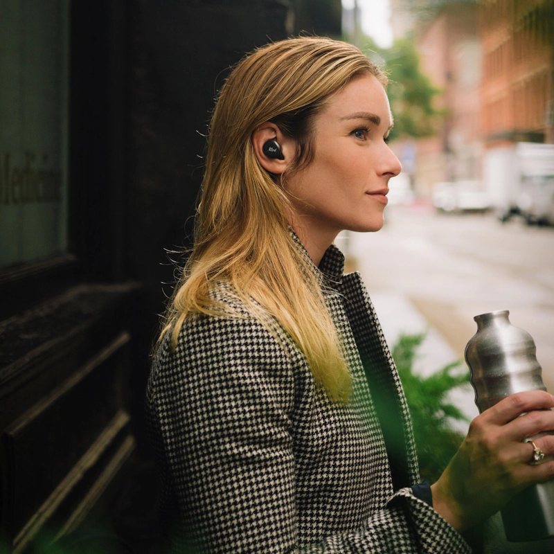 Klipsch T5 II active noise canceling earbuds woman outside building