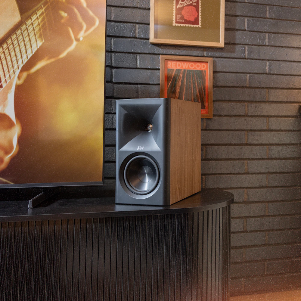 Klipsch The Fives WN in loft beside tv on modern media console with Americana art on wall behind 2000x2000