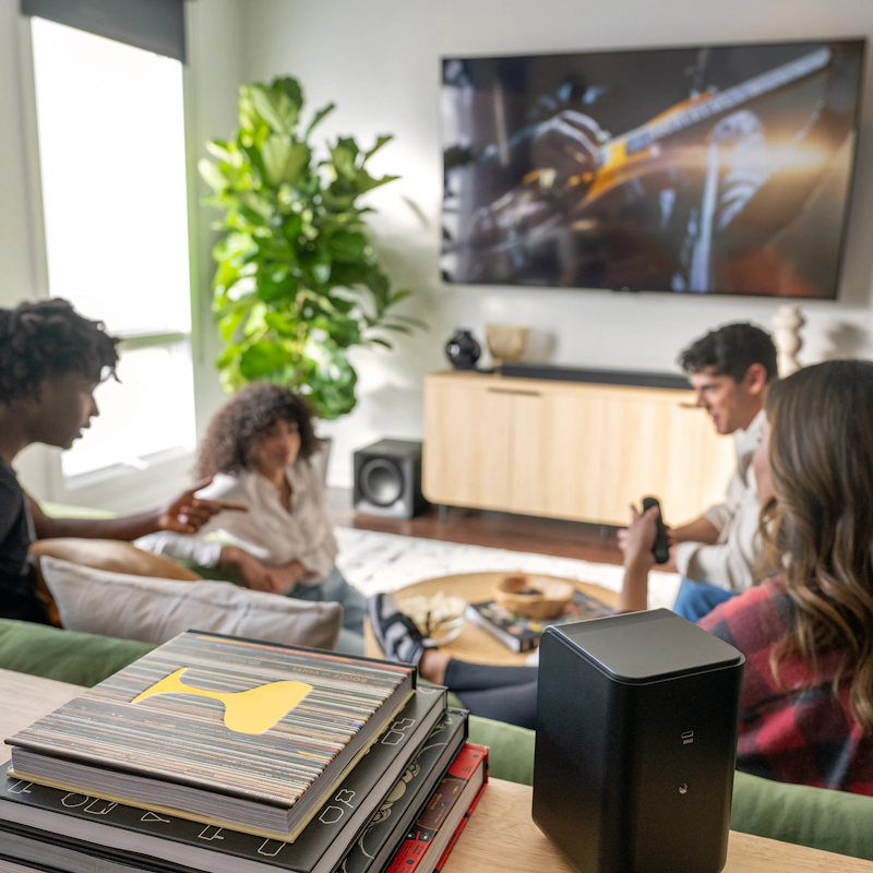 Klipsch Flexus SURR 100 behind friends hanging out 2000x2000