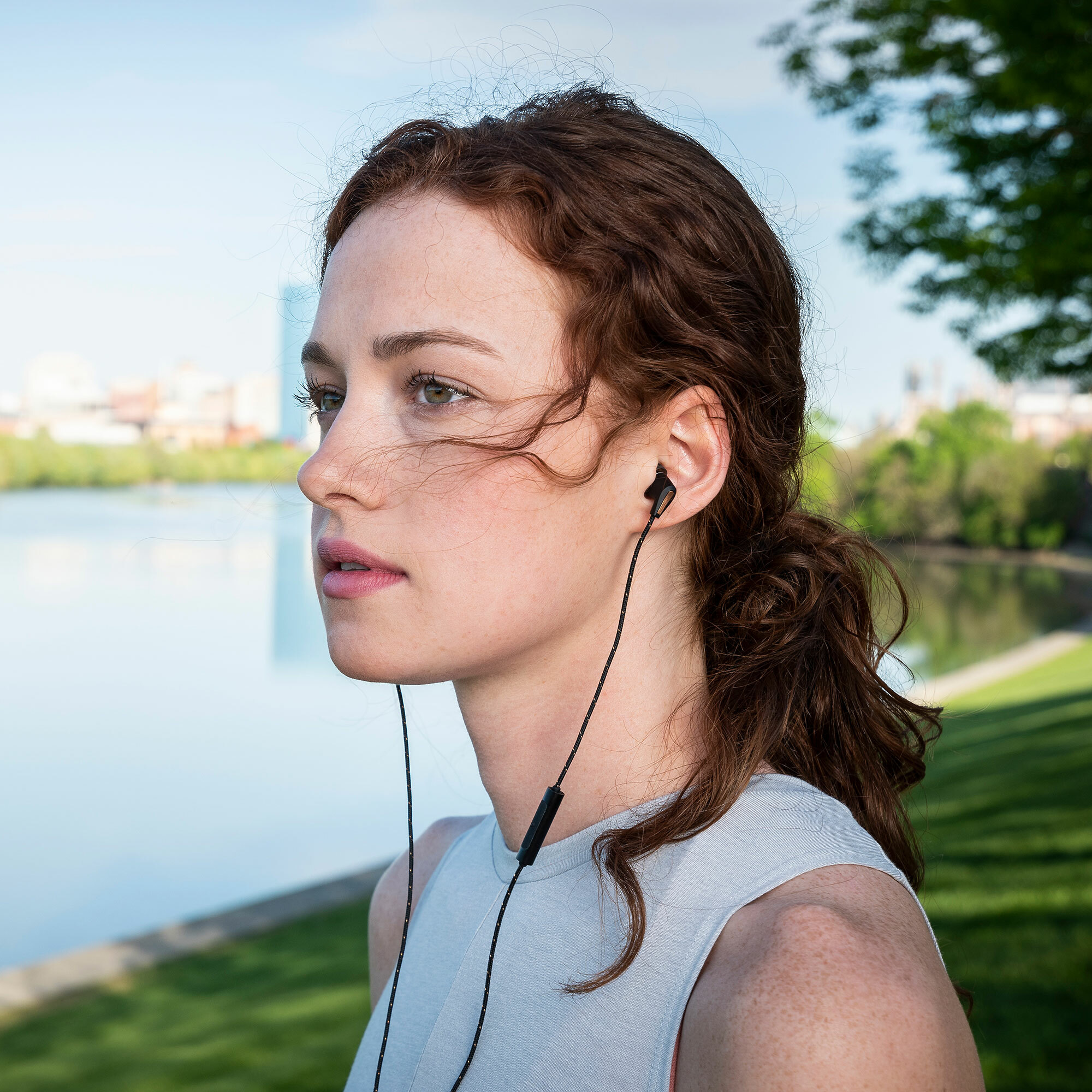 Klipsch T5 M red haired woman near river