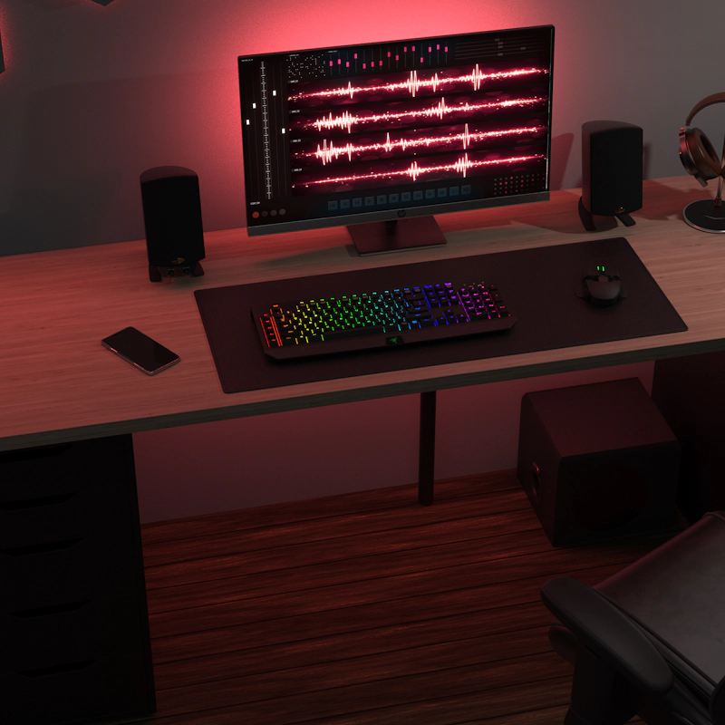 Pro Media 2 1 THX speakers on a desk with a montor keyboard mouse headphones and a phone
