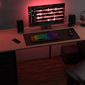 Pro Media 2 1 THX speakers on a desk with a montor keyboard mouse headphones and a phone