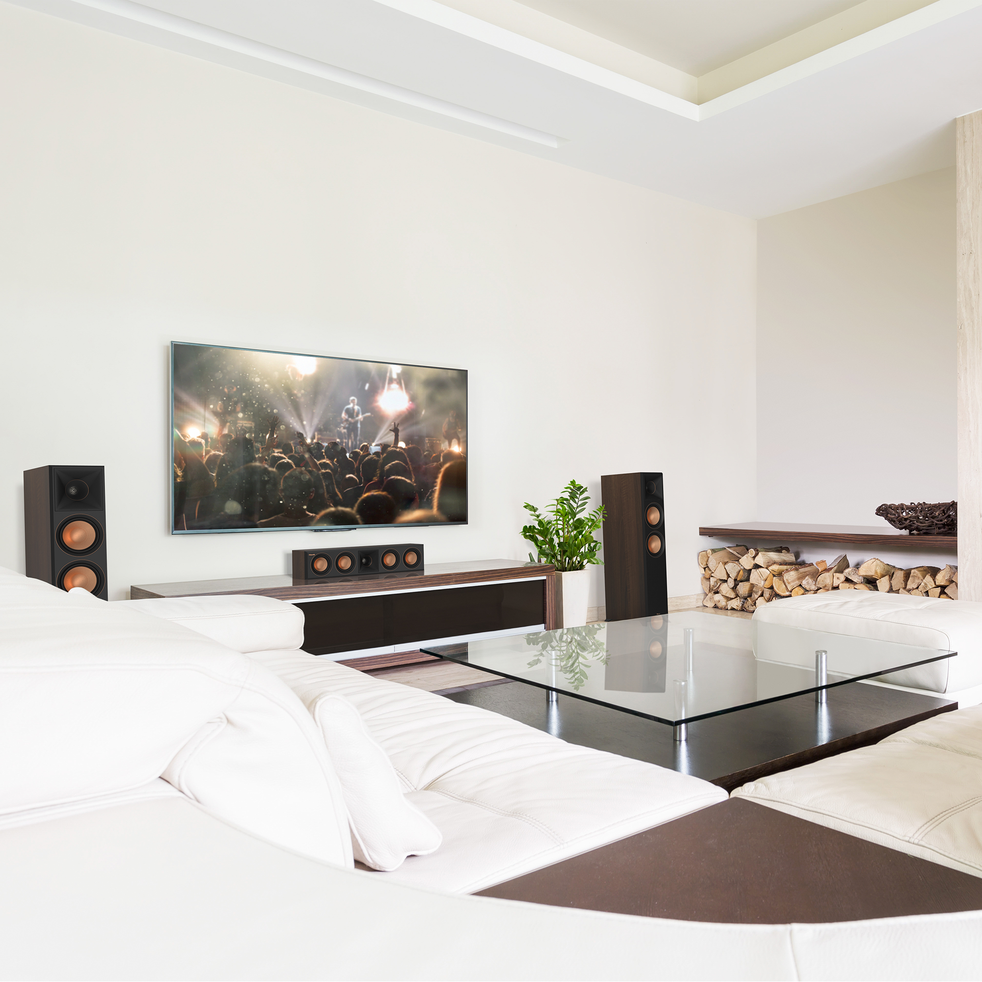 RP 404 C II sitting on a white and brown wooden credenza under a TV with its grille off in a living room setting