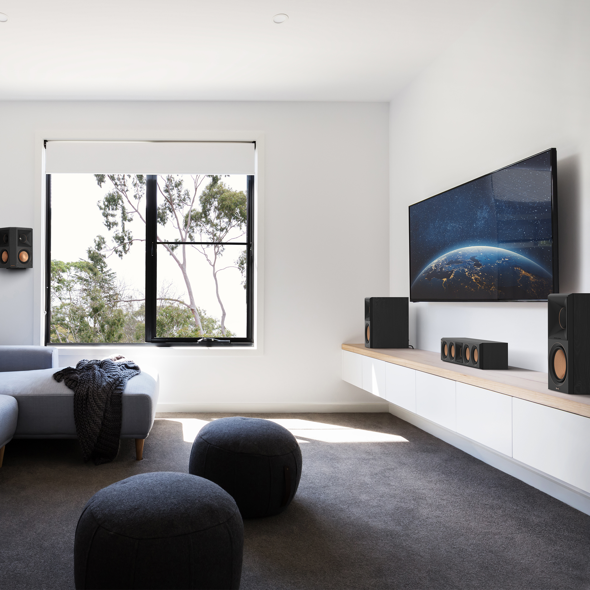 RP 404 C II sitting on a white and wooden credenza under a TV with its grille off