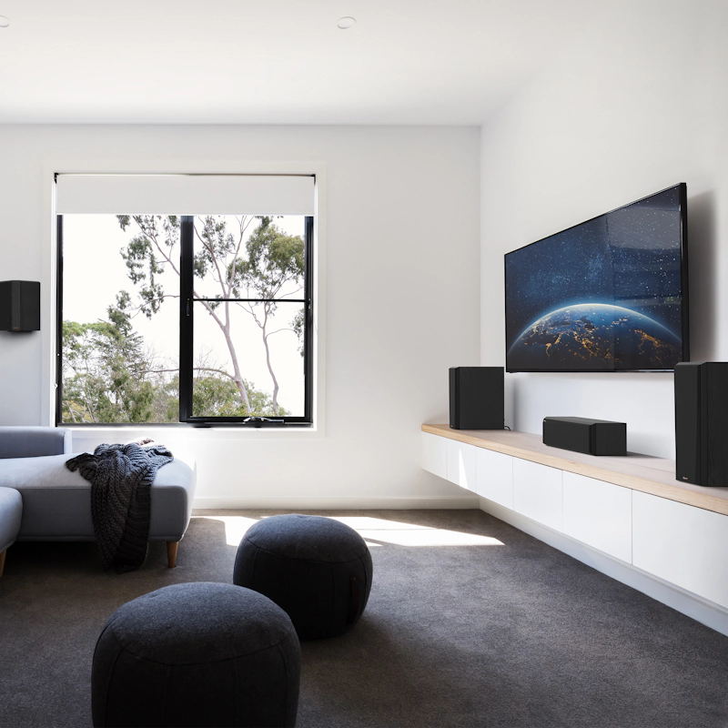 RP 404 C II sitting on a white and wooden credenza under a TV with its grille on