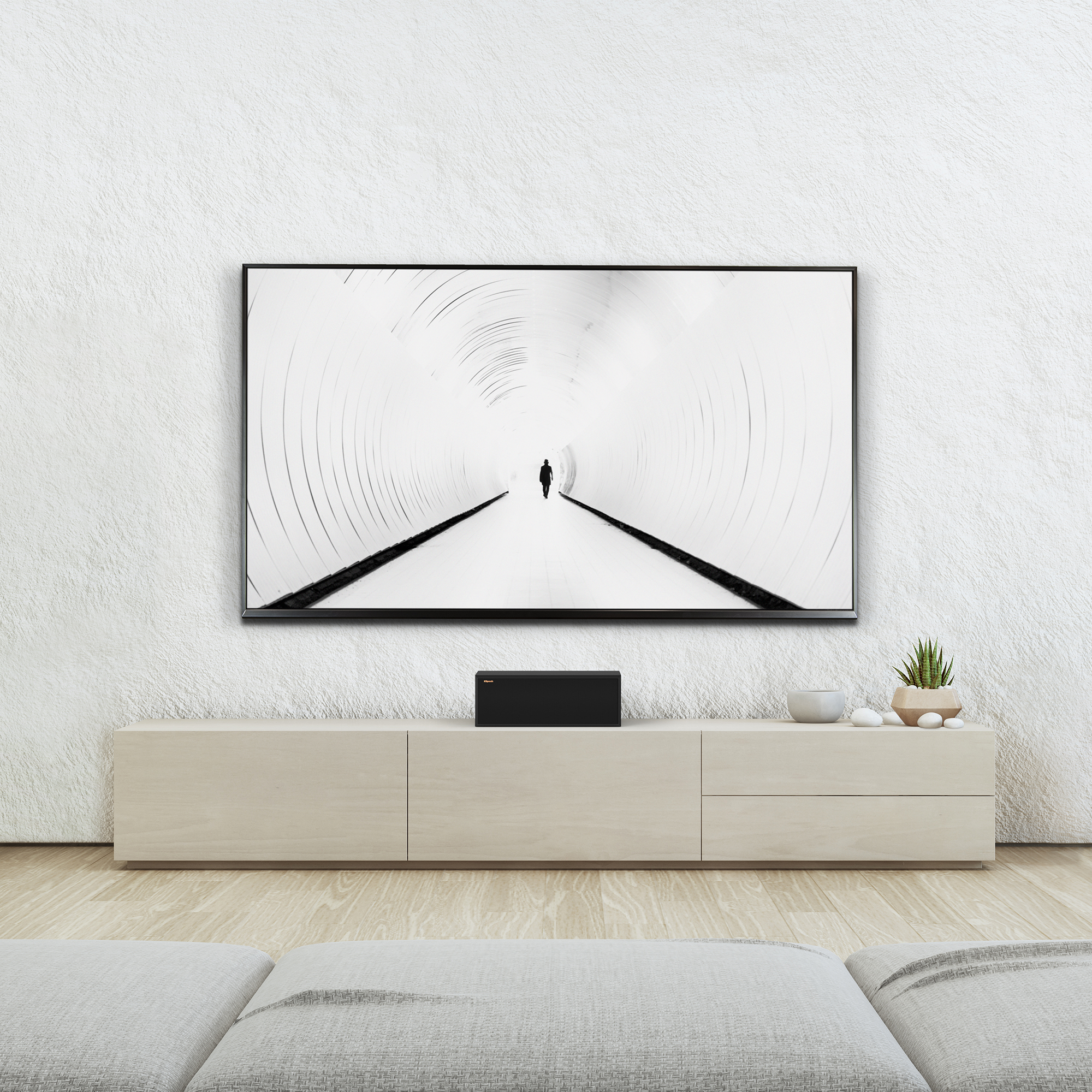 RP 500 C II sitting on a beige credenza under a TV with grille on