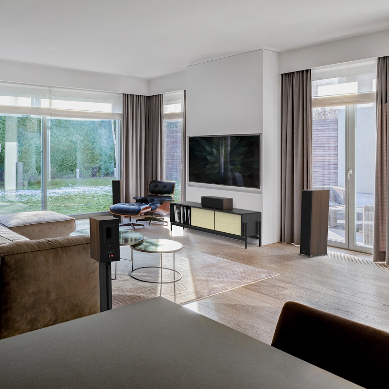 RP 500 C II sitting on a black and beige credenza under a TV with grille on