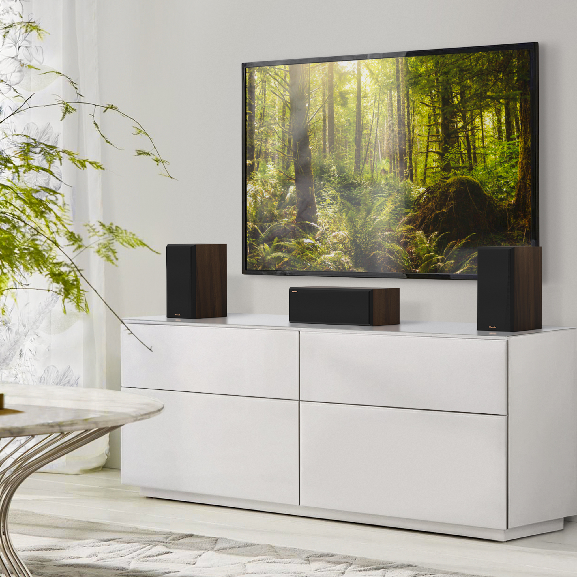 RP 500 C II sitting on a grey white credenza under a TV with grilles on