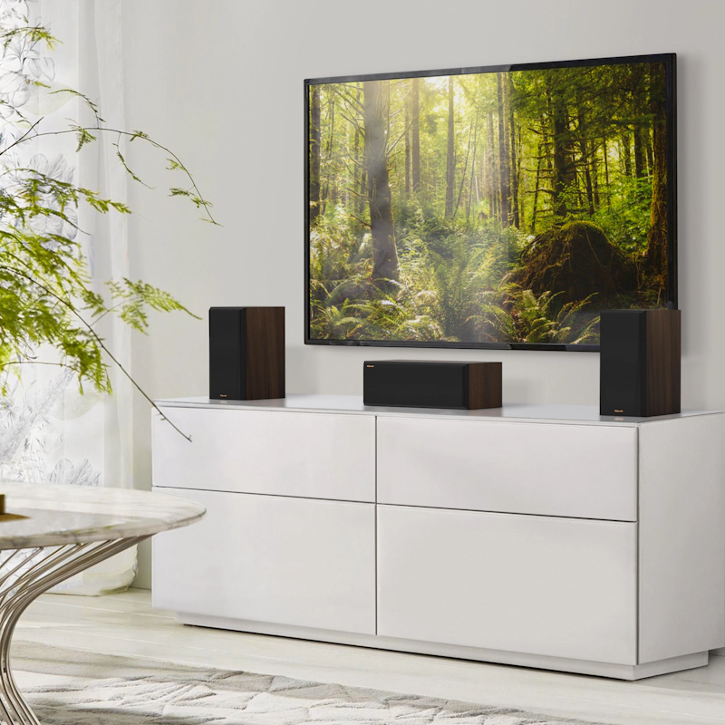 RP 500 C II sitting on a grey white credenza under a TV with grilles on