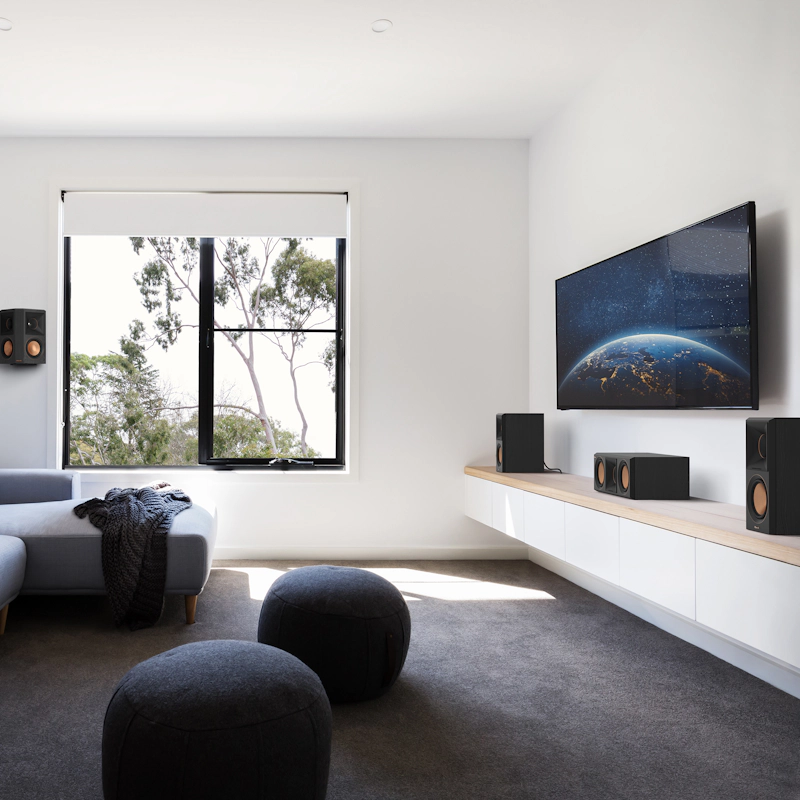 RP 500 C II sitting on a white and wood colored credenza under a TV in front of some interesting furniture