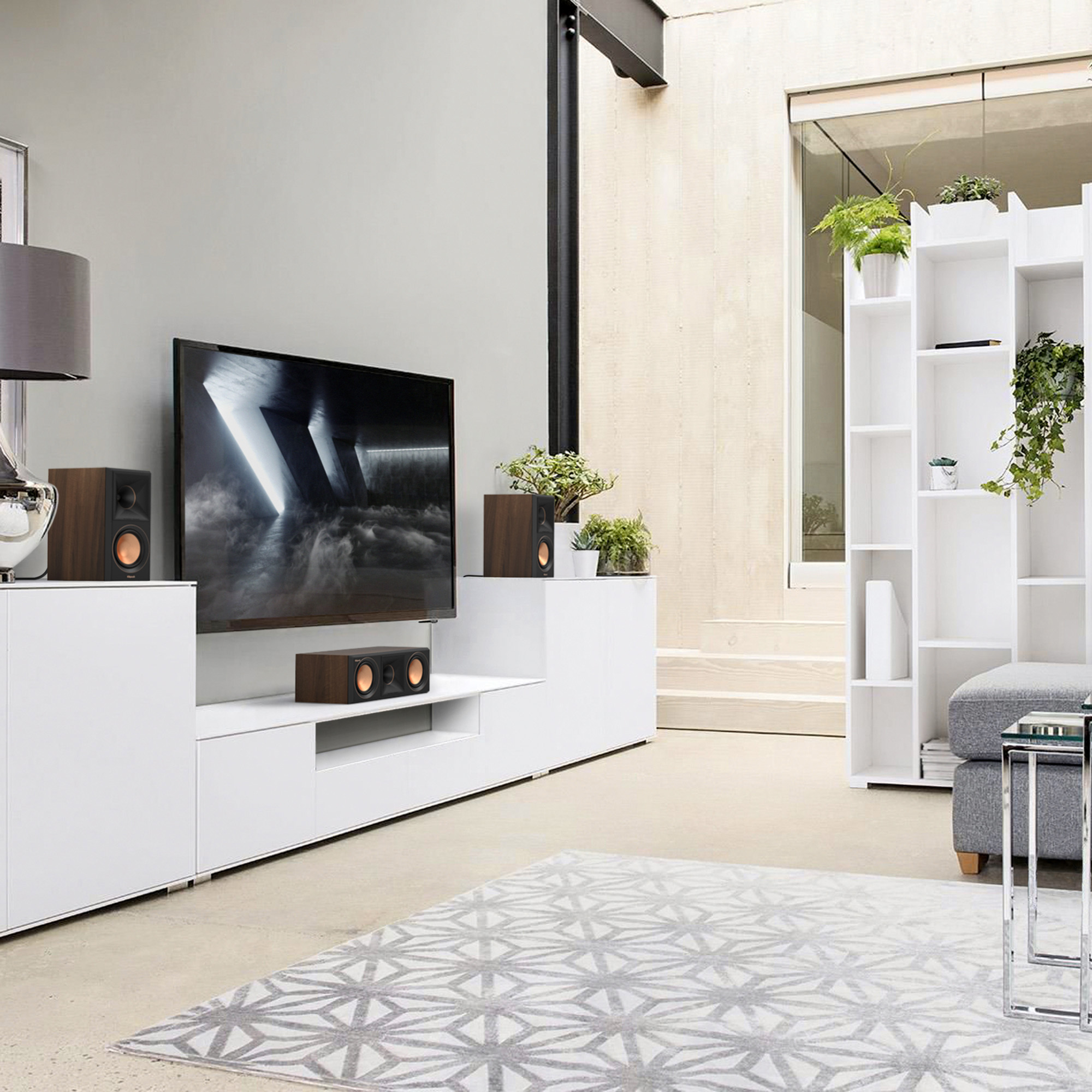 RP 500 C II sitting on a white credenza under a TV in front of a rug