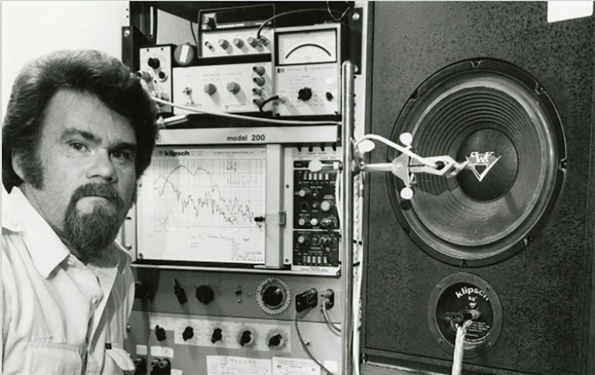 Vintage image of Klipsch engineer demonstrating distortion