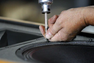 Man building a speaker